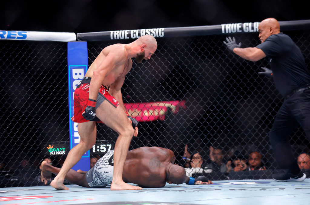 Jiri Prochazka, top left, of Czechia, knocks out Khalil Rountree Jr., bottom, of the United States, in a light heavyweight bout during UFC 320, Saturday, Oct. 4, 2025, in Las Vegas. (Steve Marcus/Las Vegas Sun via AP)