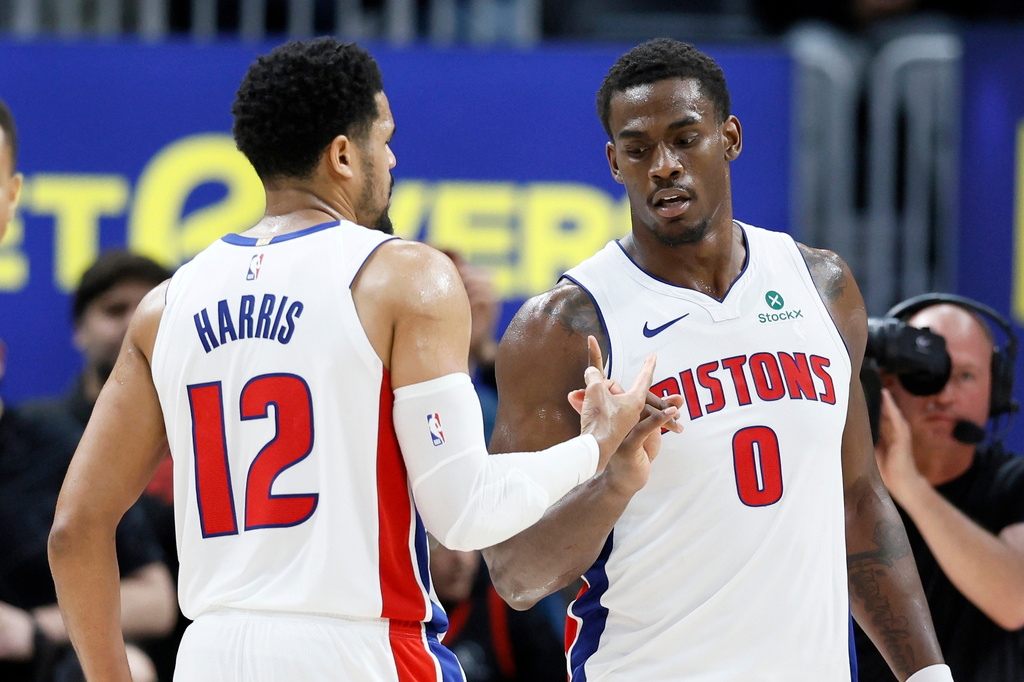 Detroit Pistons forward Tobias Harris (12) celebrates with center Jalen Duren (0) after a win over the Toronto Raptors in an NBA basketball game Tuesday, March 31, 2026, in Detroit. (AP Photo/Duane Burleson)