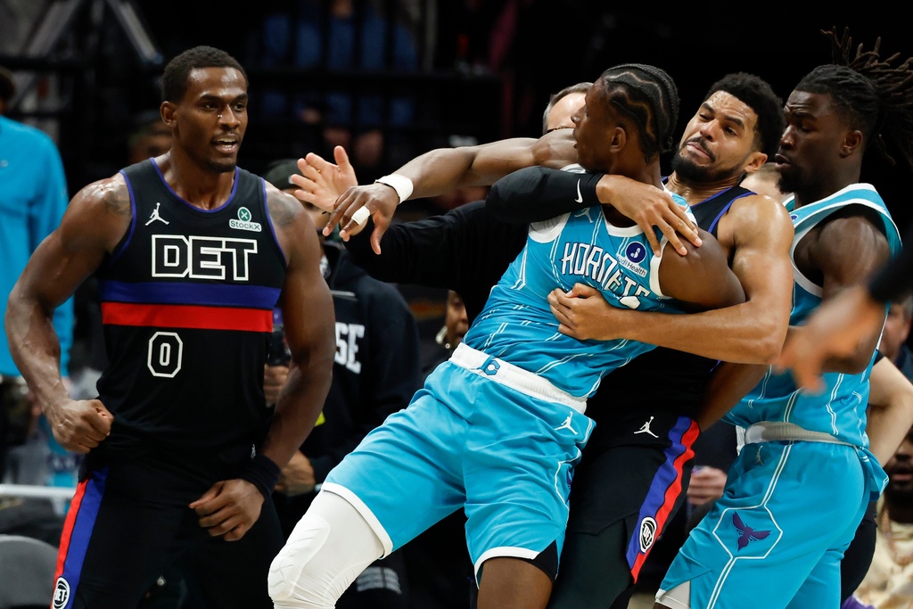 Charlotte Hornets forward Moussa Diabate, front right, is held back as he fights with Detroit Pistons center Jalen Duren (0) fight during the second half of an NBA basketball game in Charlotte, N.C., Monday, Feb. 9, 2026. (AP Photo/Nell Redmond)