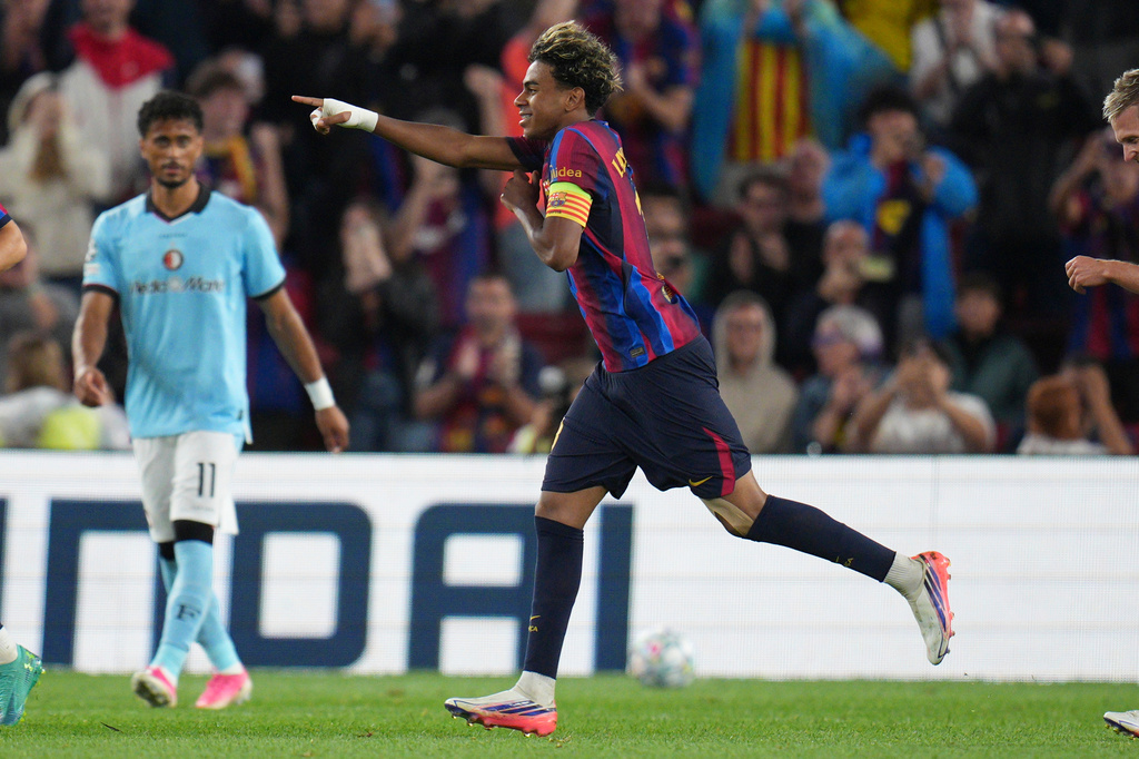 Barcelona's Lamine Yamal celebrates after scoring his side's fourth goal during the Champions League opening phase soccer between Barcelona and Feyenoord in Barcelona, Spain, Wednesday, Sept. 9, 2026.(AP Photo/Emilio Morenatti)