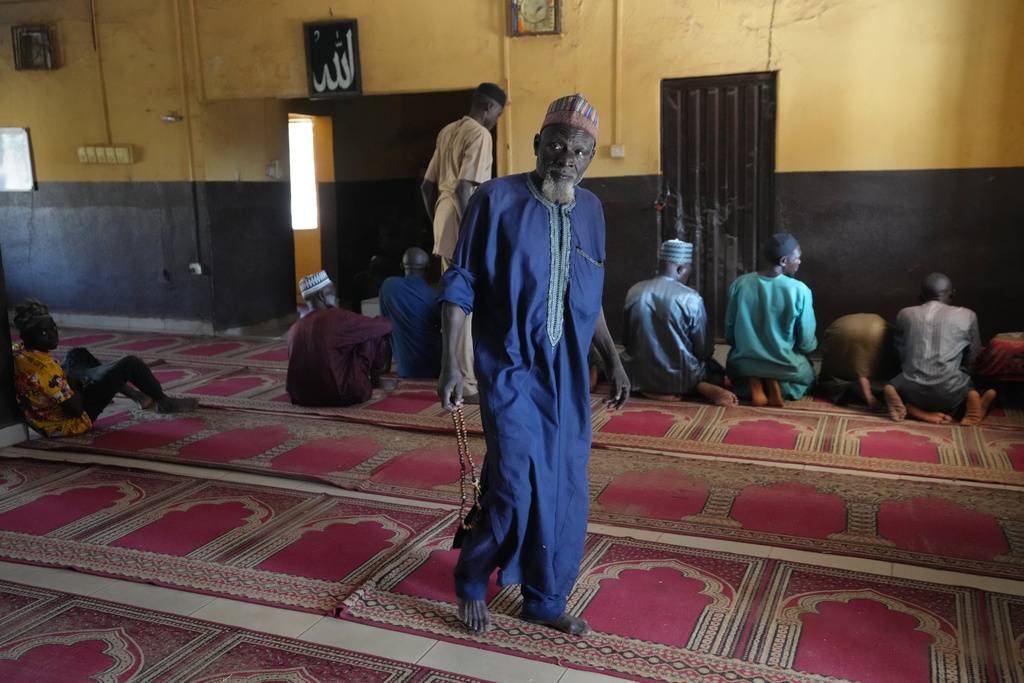 Haruna Adamu, an imam who said he has lost two brothers in his country’s violence, leaves after a prayers at a mosque in Kaduna, northwestern Nigeria, Nov. 5, 2025. (AP Photo/Sunday Alamba)