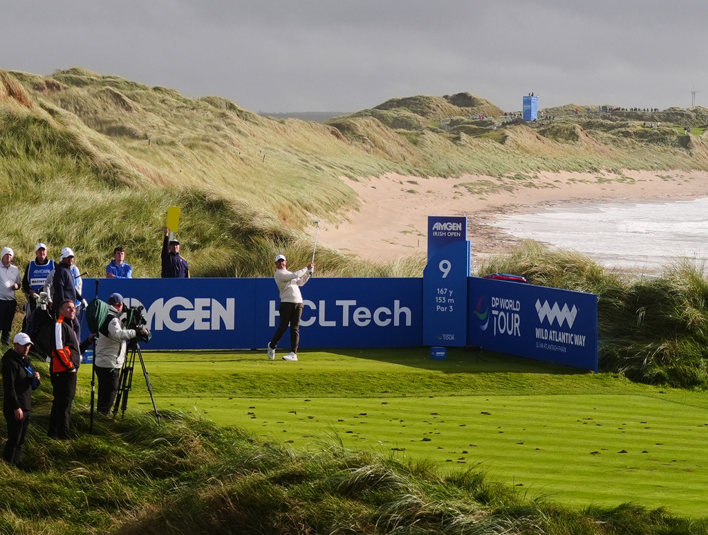 Rory McIlroy, of Northern Ireland, hits from the ninth tee during the first round of the Irish Open golf tournament, Thursday, Sept. 10, 2026, in Doonbeg, Ireland. (Brian Lawless/PA via AP)
