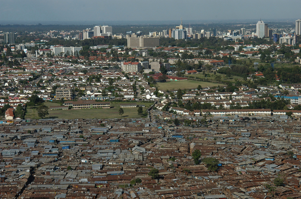 FILE -An aerial view of the slum of Kibera with the Nairobi skyline in the background, Kenya, Jan. 4, 2008. (AP Photo/Riccardo Gangale, File)