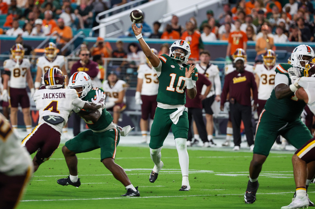 Miami quarterback Darian Mensah (10) throws a touchdown pass against Central Michigan during the first half of an NCAA college football game, Saturday, Sept. 26, 2026, in Miami Gardens, Fla. (AP Photo/David Santiago)
