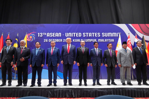President Donald Trump poses for a family photo with, from left, Singapore Prime Minister Lawrence Wong, East Timor's Prime Minister Kay Rala Xanana Gusmao, Vietnam's Prime Minister Pham Minh Chinh, Cambodian Prime Minister Hun Manet, Malaysian Prime Minister Anwar Ibrahim, Philippine President Ferdinand Marcos Jr., the Sultan of Brunei Hassanal Bolkiah, Indonesian President Prabowo Subianto and Laos' Prime Minister Sonexay Siphandone at the ASEAN Summit in Kuala Lumpur, Malaysia, Sunday, Oct. 26, 2025. (AP Photo/Mark Schiefelbein) President Donald Trump poses for a family photo with, from left, Singapore Prime Minister Lawrence Wong, East Timor's Prime Minister Kay Rala Xanana Gusmao, Vietnam's Prime Minister Pham Minh Chinh, Cambodian Prime Minister Hun Manet, Malaysian Prime Minister Anwar Ibrahim, Philippine President Ferdinand Marcos Jr., the Sultan of Brunei Hassanal Bolkiah, Indonesian President Prabowo Subianto and Laos' Prime Minister Sonexay Siphandone at the ASEAN Summit in Kuala Lumpur, Malaysia, Sunday, Oct. 26, 2025. (AP Photo/Mark Schiefelbein)