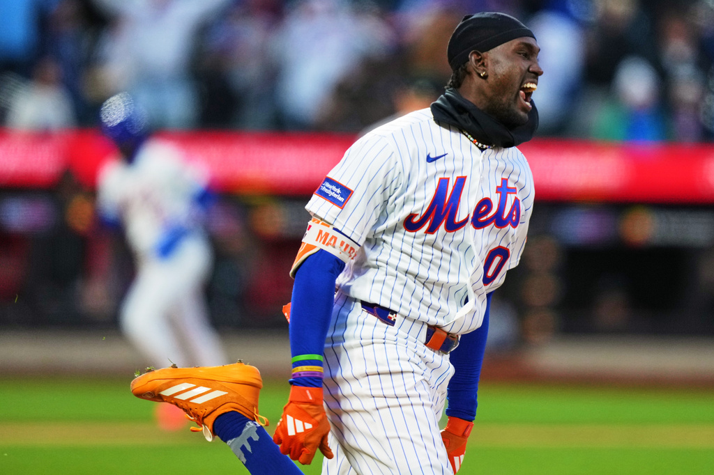 New York Mets' Ronny Mauricio (0) celebrates after hitting a walk-off single during the tenth inning of a baseball game Tuesday, April 7, 2026, in New York. (AP Photo/Frank Franklin II)