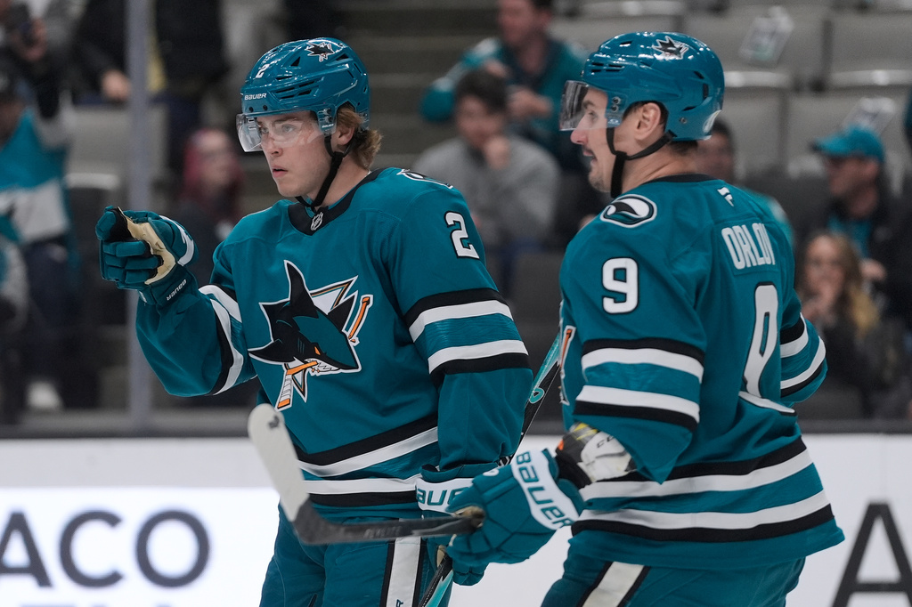 San Jose Sharks center Will Smith, left, celebrates with defenseman Dmitry Orlov (9) after scoring against the Anaheim Ducks during the first period of an NHL hockey game in San Jose, Calif., Wednesday, April 1, 2026. (AP Photo/Jeff Chiu)