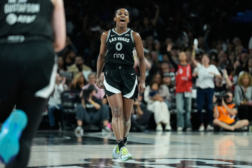 Las Vegas Aces guard Jackie Young (0) celebrates after making a 3-point shot during the second half in Game 2 of the WNBA basketball finals against the Phoenix Mercury, Sunday, Oct. 5, 2025, in Las Vegas. (AP Photo/John Locher) Las Vegas Aces guard Jackie Young (0) celebrates after making a 3-point shot during the second half in Game 2 of the WNBA basketball finals against the Phoenix Mercury, Sunday, Oct. 5, 2025, in Las Vegas. (AP Photo/John Locher)