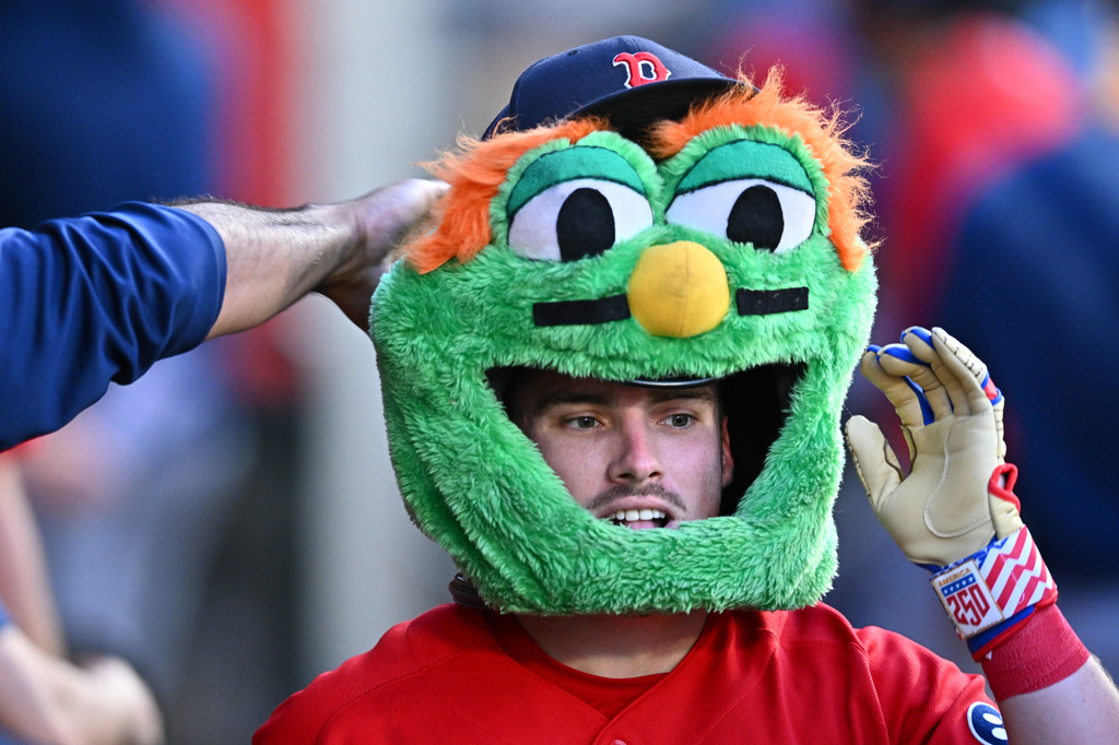 Boston Red Sox's Caleb Durbin is greeted by teammates after hitting a home run during the fifth inning of a baseball game against the Los Angeles Angels, Friday, July 3, 2026, in Anaheim, Calif. (AP Photo/William Liang)