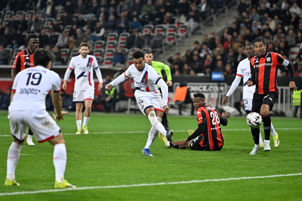 PSG's Desire Doue scores his side's second goal during the French League One soccer match between Nice and Paris Saint-Germain in Nice, France, Saturday, March 21, 2026. (AP Photo/Philippe Magoni)