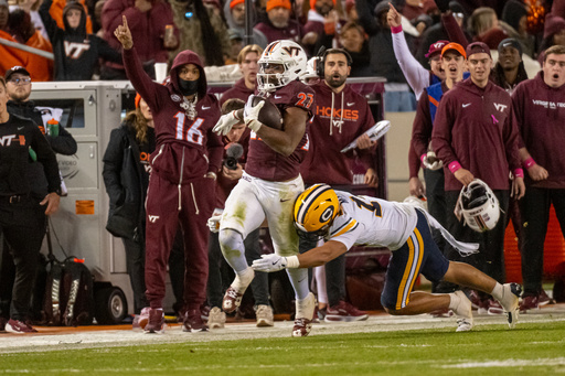 Virginia Tech running back Marcellous Hawkins (27) runs for a first down during an NCAA college football game between California and Virginia Tech, Friday Oct. 24, 2025, in Blacksburg, Va., (AP Photo/Robert Simmons) Virginia Tech running back Marcellous Hawkins (27) runs for a first down during an NCAA college football game between California and Virginia Tech, Friday Oct. 24, 2025, in Blacksburg, Va., (AP Photo/Robert Simmons)