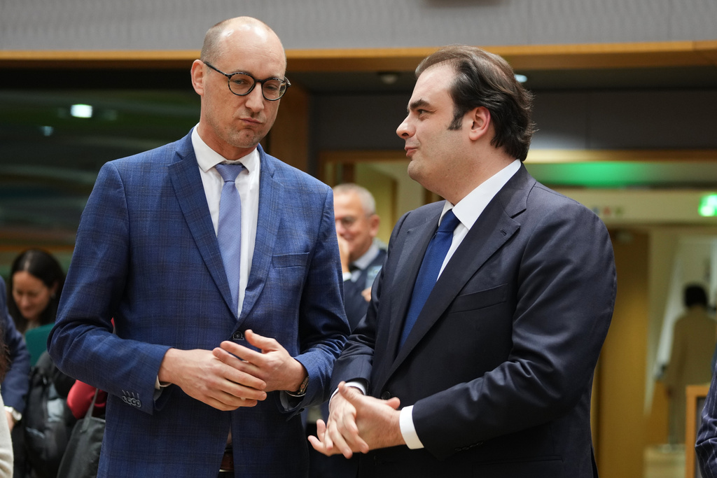 Belgium's Finance Minister Vincent Van Peteghem, left, speaks with Greece's Finance Minister Kyriakos Pierrakakis during a meeting of eurozone finance ministers at the EU Council building in Brussels, Thursday, Dec. 11, 2025. (AP Photo/Virginia Mayo)