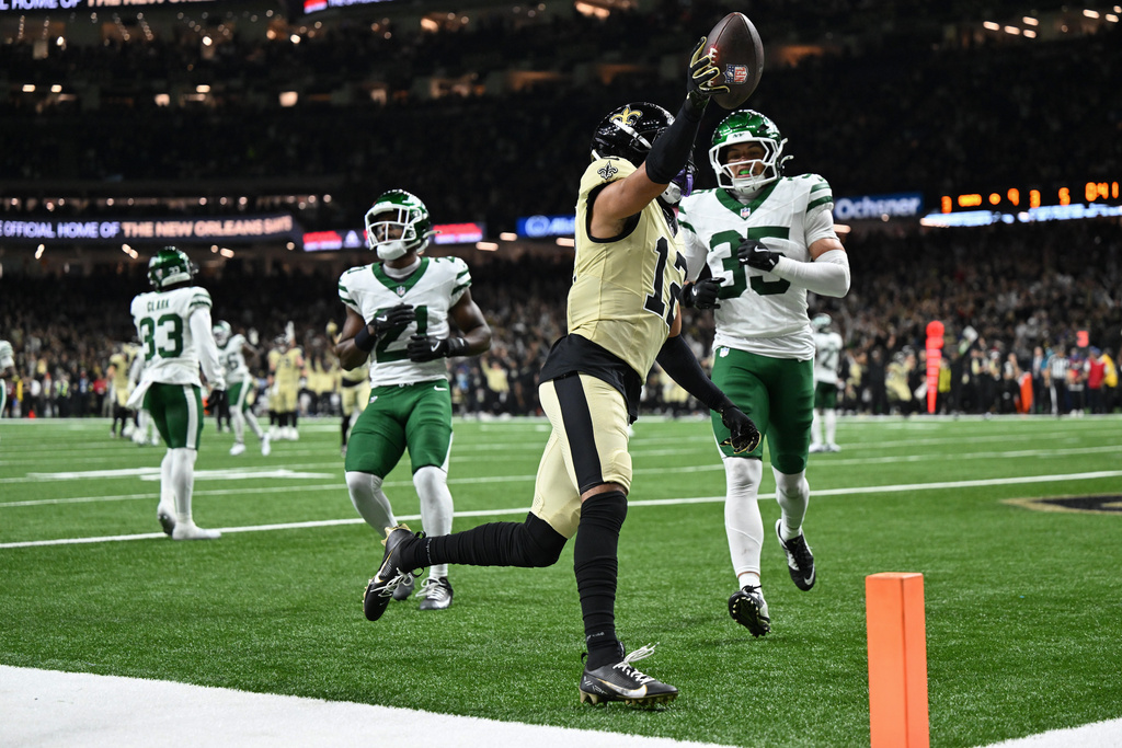 New Orleans Saints wide receiver Chris Olave celebrates after scoring a touchdown during the second half of an NFL football game against the New York Jets, Sunday, Dec. 21, 2025, in New Orleans. (AP Photo/Ella Hall)