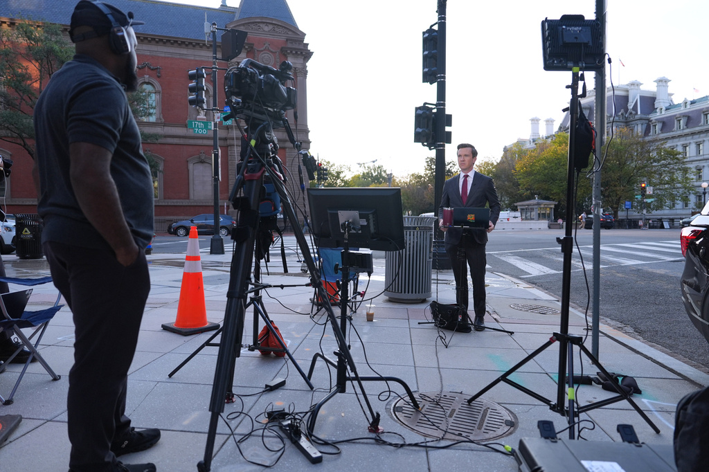 Vaughn Hillyard, White House correspondent for MS NOW, does a report from near the White House,, Monday, Sept. 21, 2026, in Washington. (AP Photo/Mark Schiefelbein)