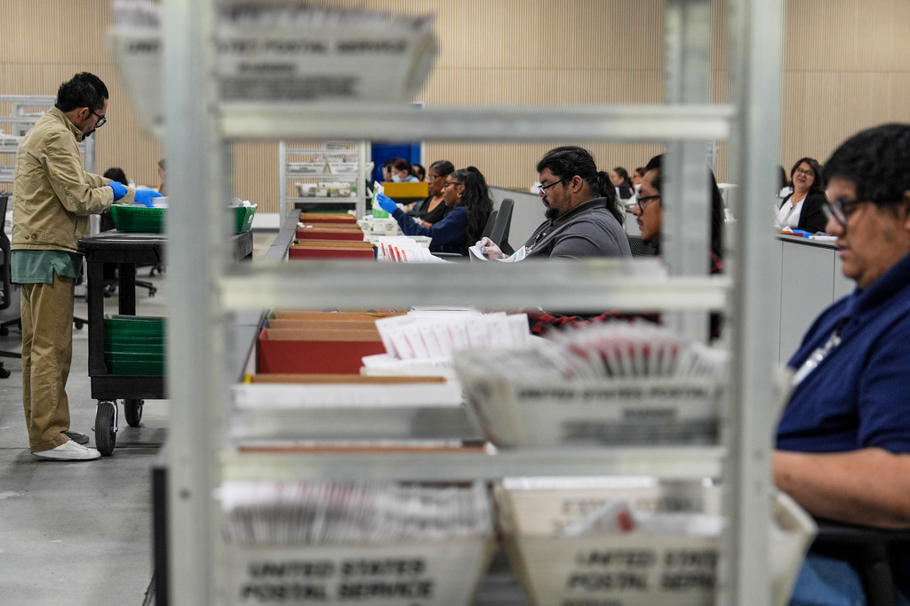 FILE - Ballots are inspected the day after California's primary election at the Los Angeles County Ballot Processing Center, June 3, 2026, in City of Industry, Calif. (AP Photo/Jae C. Hong, File)