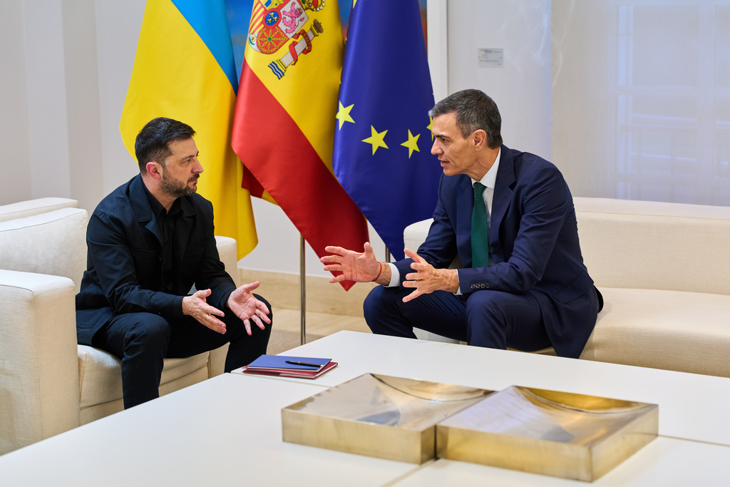 Spanish Prime Minister Pedro Sanchez, right, and Ukrainian President Volodymyr Zelenskyy talk during their meeting at the Moncloa Palace in Madrid, Spain, Tuesday, Nov. 18, 2025. (AP Photo/Bernat Armangue)