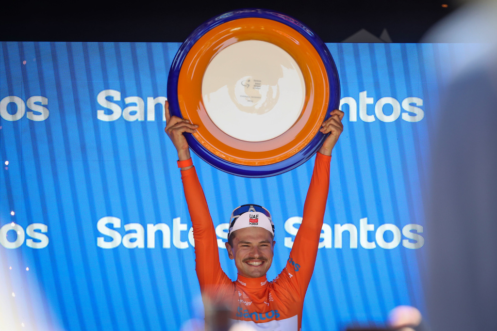 Jay Vine of UAE Team Emirates celebrates victory after stage five of the Tour Down Under road cycle race in Adelaide, Australia, Sunday, Jan. 25, 2026. (Matt Turner/AAP Image via AP)