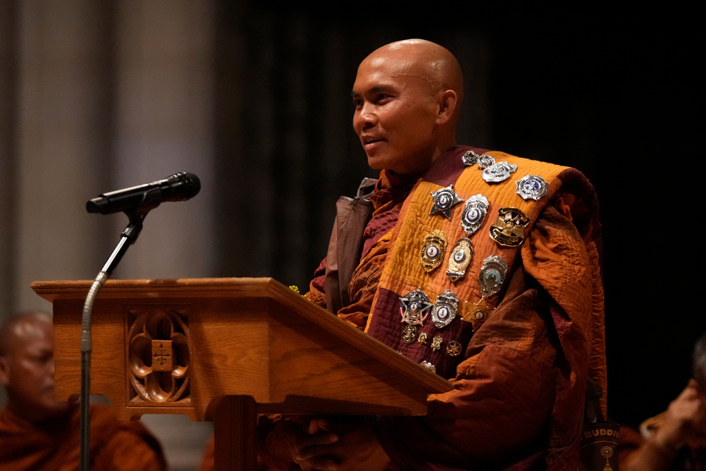 Monk Bhikkhu Pannakara speaks during an event at Washington National Cathedral with his fellow Buddhist monks who are participating in a Walk For Peace, Tuesday, Feb. 10, 2026, in Washington. (AP Photo/Mark Schiefelbein)