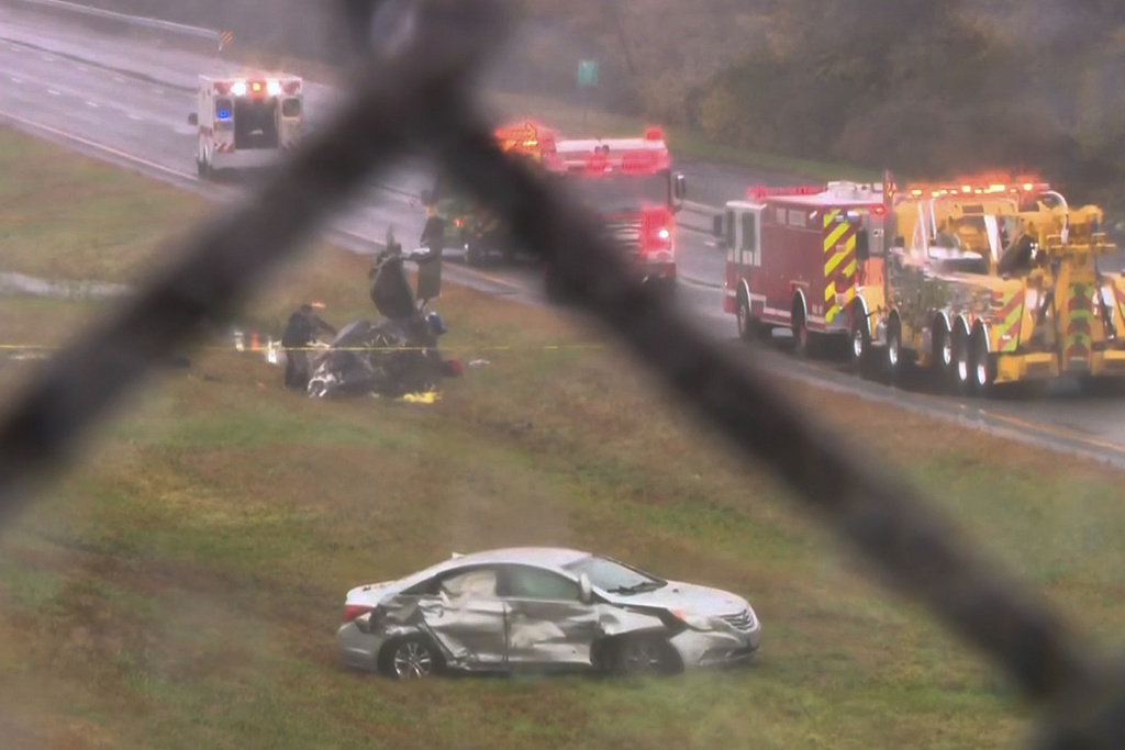 This image made from video provided by WCVB-TV, shows the scene after a small plane crashed onto a highway in Dartmouth, Mass., Monday Oct. 13, 2025. (WCVB-TV via AP)