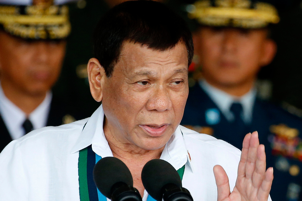 FILE - Philippine President Rodrigo Duterte addresses the troops during the 82nd anniversary celebration of the Armed Forces of the Philippines in suburban Quezon city northeast of Manila, Philippines on Dec. 20, 2017. (AP Photo/Bullit Marquez, File)
