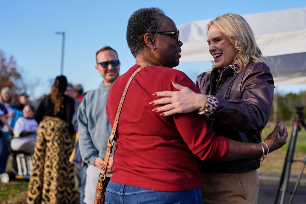 Democratic congressional candidate State Rep. Aftyn Behn, D-Nashville, right, greets Teresa Eslick, left, during a campaign event in the special election for the seventh district, Thursday, Nov. 13, 2025, Nashville, Tenn. (AP Photo/George Walker IV)