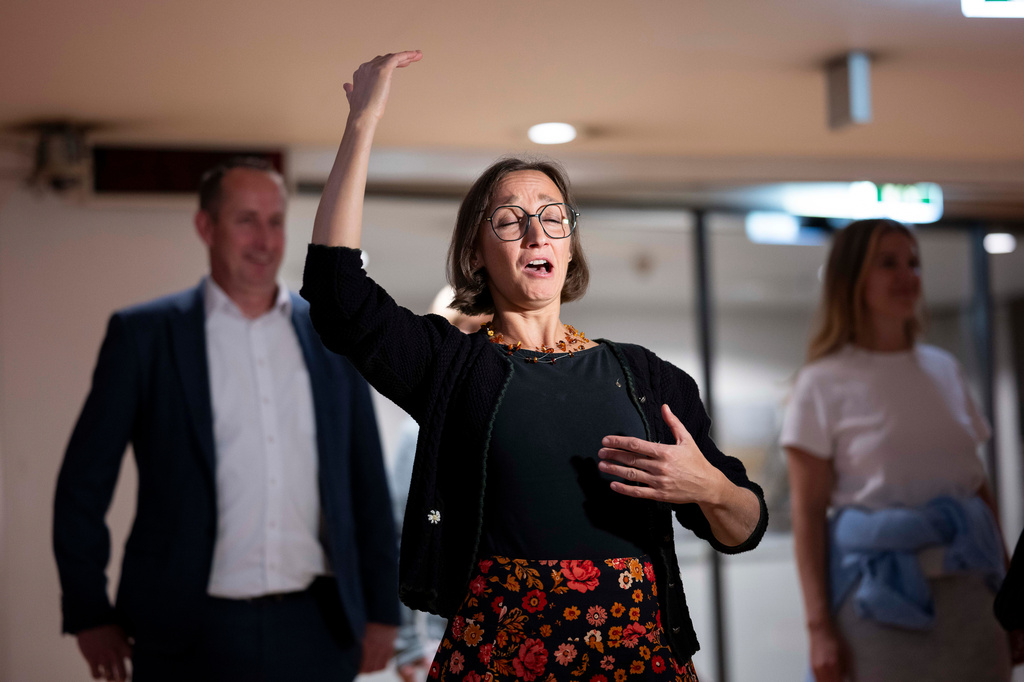 A woman yodels during a public event in an underground garage in Graz, Austria, on Wednesday, Sept. 23, 2026. (AP Photo/Denes Erdos)