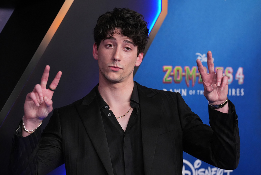 FILE - Milo Manheim, a cast member in "Zombies 4: Dawn of the Vampires," arrives at the premiere of the film July 8, 2025, at El Capitan Theatre in Los Angeles. (AP Photo/Chris Pizzello, File)