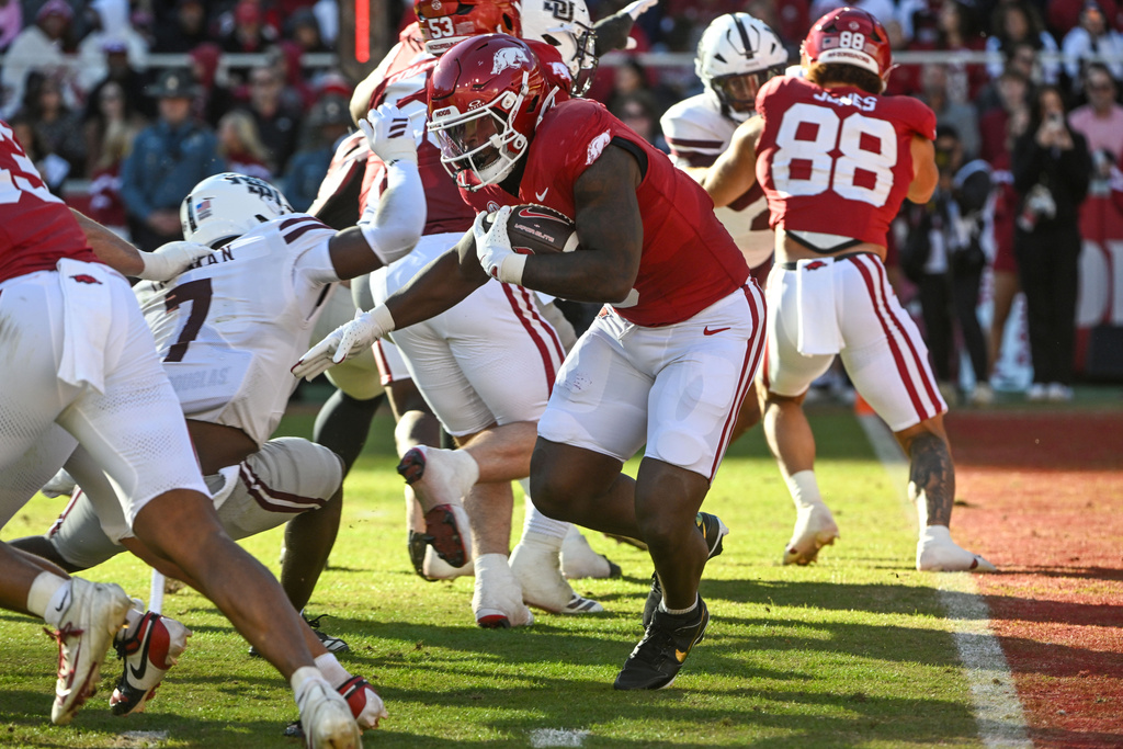 Arkansas running back Braylen Russell (0) runs the ball against Mississippi State during the first half of an NCAA college football game Saturday, Nov. 1, 2025, in Fayetteville, Ark. (AP Photo/Michael Woods)