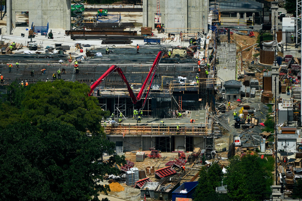 Workers continue construction on the new White House ballroom, as seen from the Washington Monument, Monday, Aug. 17, 2026, in Washington. (AP Photo/Julia Demaree Nikhinson)