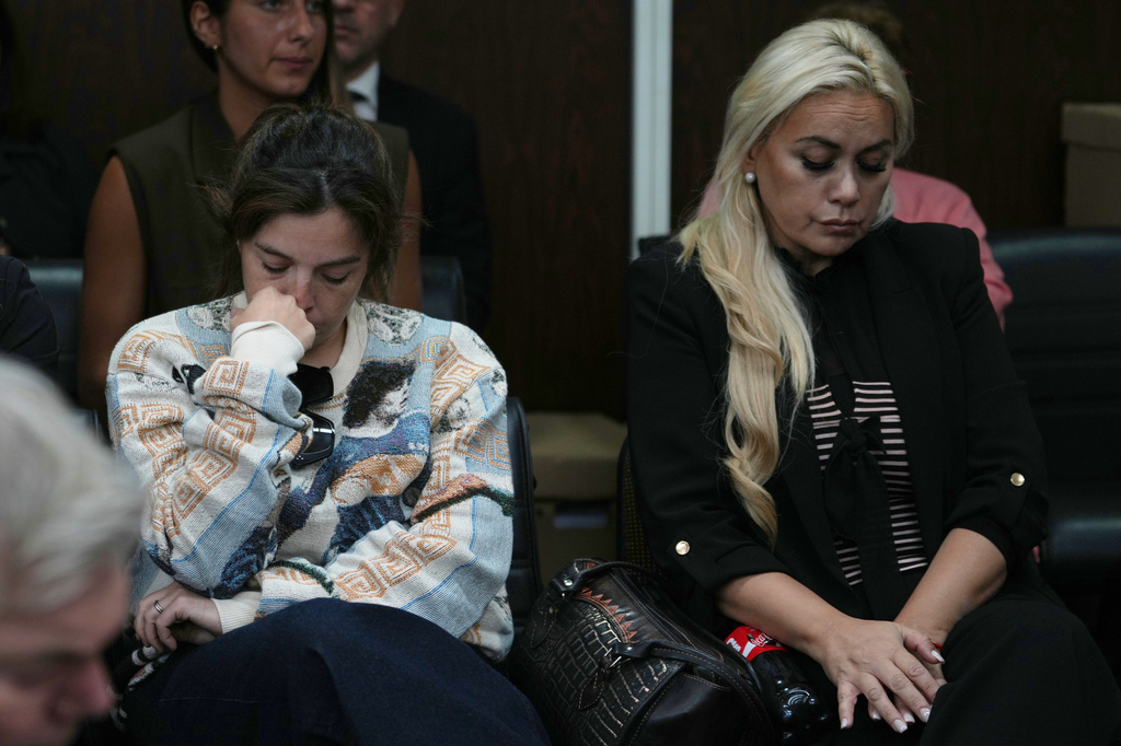 Dalma Maradona, left, the daughter of late Diego Maradona, and Veronica Ojeda, former partner of the late soccer star, attend the first day of the trial of his medical team for alleged homicide by negligence in San Isidro, Argentina, Tuesday, April 14, 2026. (AP Photo/Rodrigo Abd)