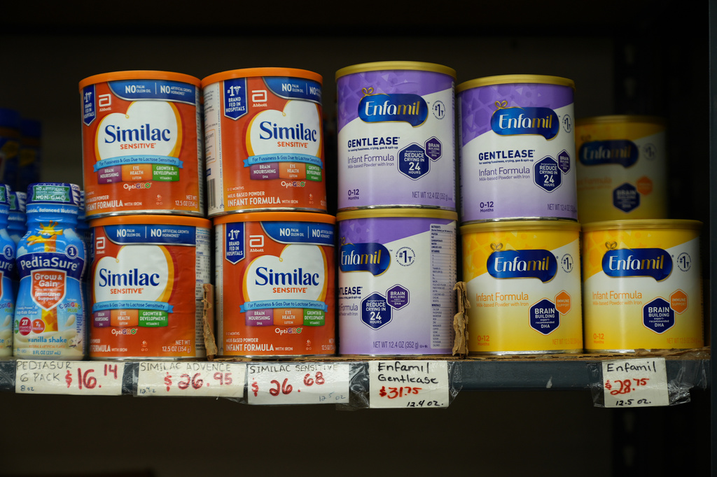 Canisters of infant formula are priced as high as $31.75 per 12.4-ounces at a market serving the Central American immigrant community in the Westlake/Pico Union area of Los Angeles, Tuesday, April 7, 2026. (AP Photo/Damian Dovarganes)