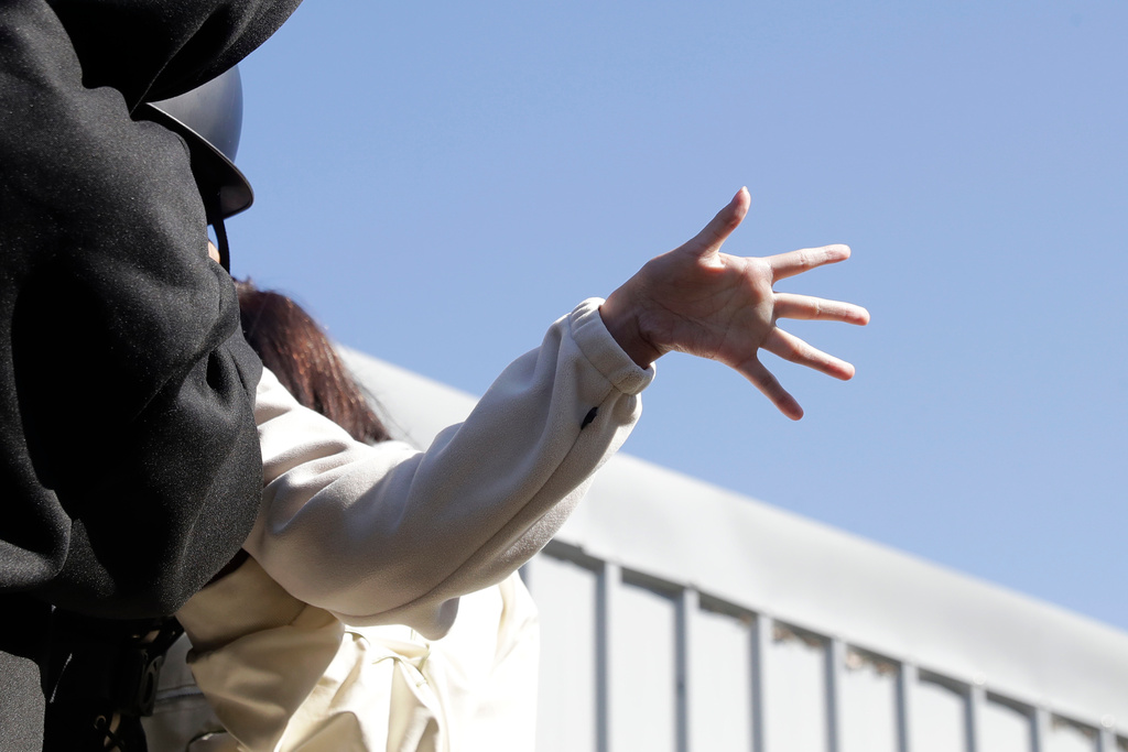 A girl reacts during an equine-assisted therapy course at the Therapeutic Riding Centre in Taoyuan in northern Taiwan on Thursday, Jan. 29, 2026. (AP Photo/Chiang Ying-ying)