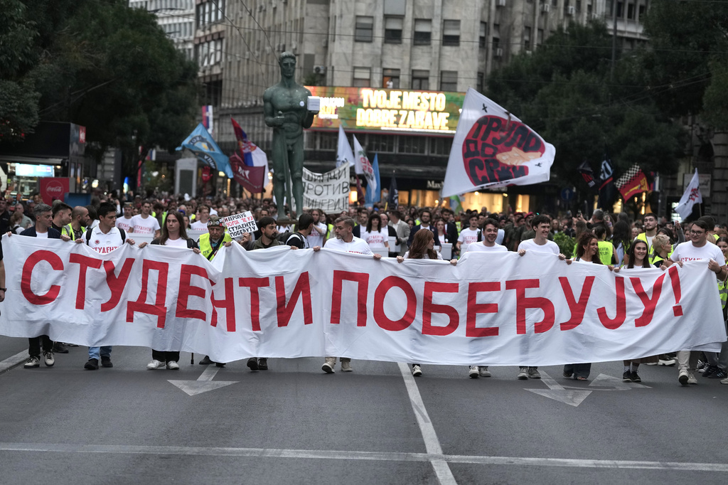 Political candidates, students and citizens carry signatures for the "Student list - Students win" to the Republic Election Commission towards participation in the upcoming parliamentary elections in Belgrade, Serbia, Monday, Sept. 14, 2026. (AP Photo/Darko Vojinovic)