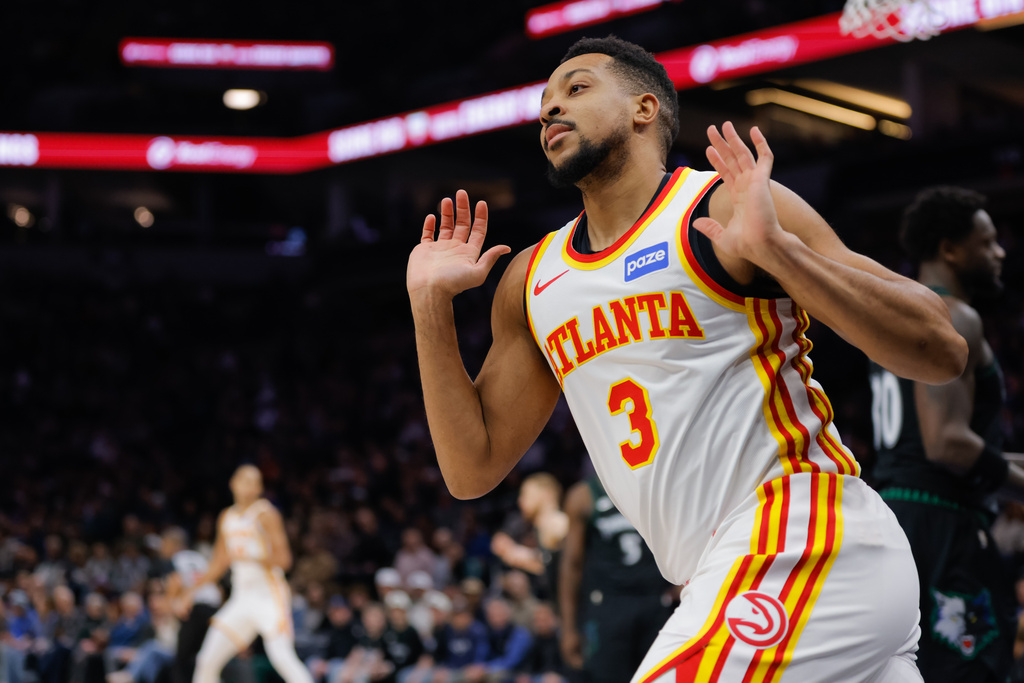 Atlanta Hawks guard CJ McCollum (3) celebrates after dunking during the first half of an NBA basketball game against the Minnesota Timberwolves, Monday, Feb. 9, 2026, in Minneapolis. (AP Photo/Bailey Hillesheim)