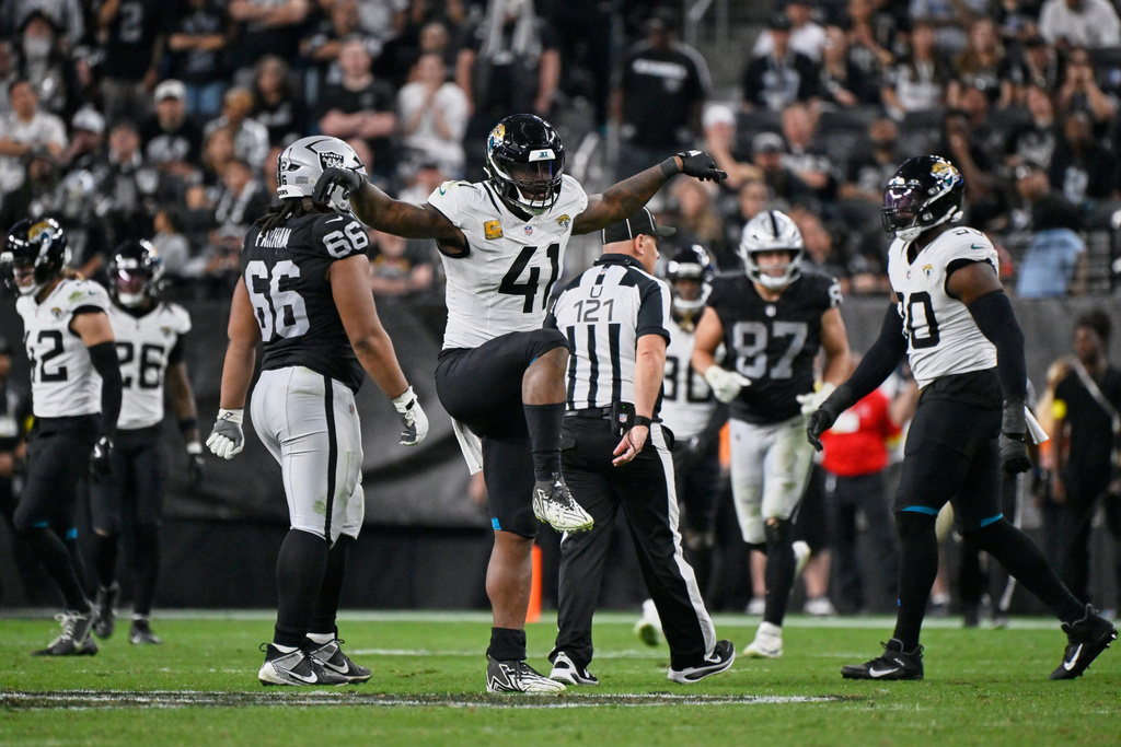 Jacksonville Jaguars defensive end Josh Hines-Allen (41) reacts after a sack during overtime of an NFL football game against the Las Vegas Raiders, Sunday, Nov. 2, 2025, in Las Vegas. (AP Photo/David Becker)