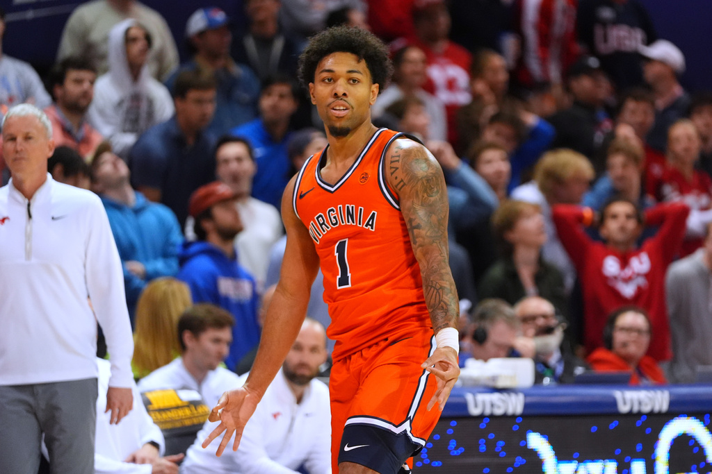 Virginia guard Malik Thomas (1) reacts after scoring a 3-pointer during the first half of an NCAA college basketball game against SMU Saturday, Jan. 17, 2026, in Dallas. (AP Photo/LM Otero)