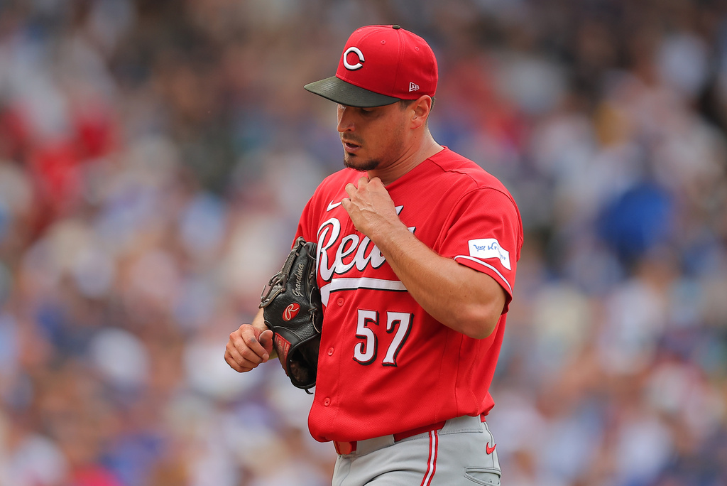 Cincinnati Reds' Julian Garcia walks back to the dugout after the fifth inning of a baseball game against the Chicago Cubs, Saturday, Aug. 29, 2026, in Chicago. (AP Photo/Melissa Tamez)