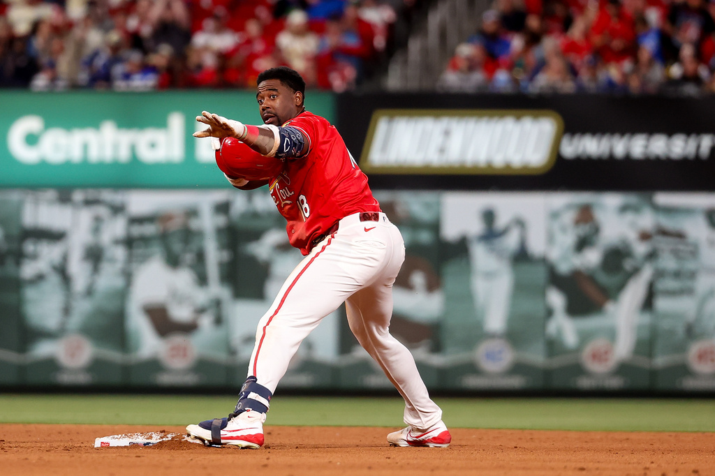 St. Louis Cardinals' Jordan Walker gestures toward the dugout after hitting a double during the fifth inning of a baseball game against the Los Angeles Dodgers Friday, May 1, 2026, in St. Louis. (AP Photo/Scott Kane)