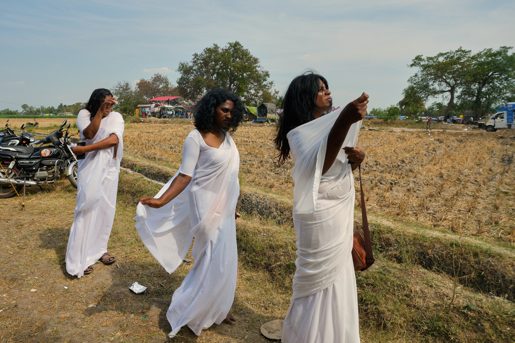Transgender participants wear white saris to mark a symbolic ritual of widowhood during the Koovagam festival in the Kallakurichi district of southern Indian state of Tamil Nadu, Wednesday, April 29, 2026. (AP Photo/Mahesh Kumar A.)