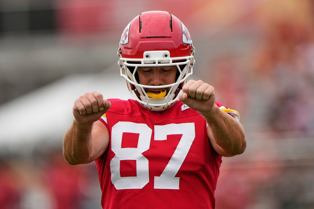 Kansas City Chiefs tight end Travis Kelce stretches during NFL football training camp Friday, July 31, 2026, in St. Joseph, Mo. (AP Photo/Charlie Riedel)