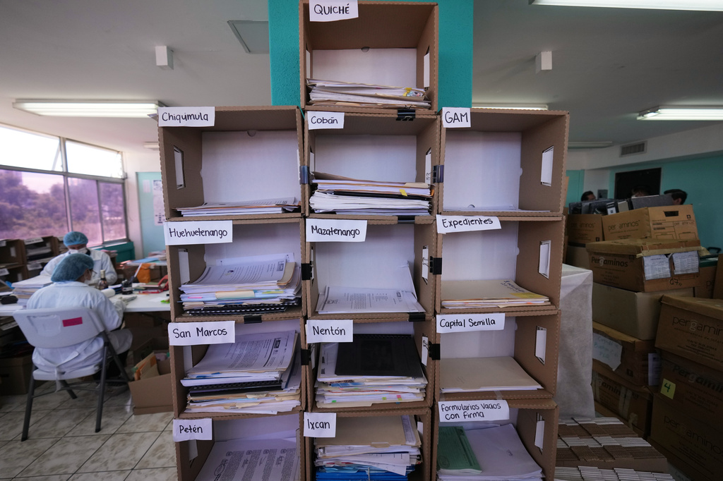 Archivists work to safeguard testimonies from victims of the internal armed conflict between 1960 and 1996, who sought reparations for the abuses they suffered, in Guatemala City, Wednesday, July 22, 2026. (AP Photo/Moises Castillo)