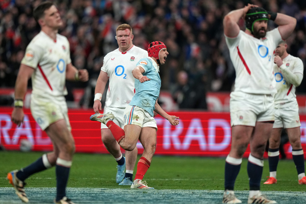 Louis Bielle‑Biarrey of France celebrates after Thomas Ramos kicked the winning penalty during the Six Nations rugby union match between France and England in Saint-Denis, outside Paris, Saturday, March 14, 2026. (AP Photo/Michel Euler)
