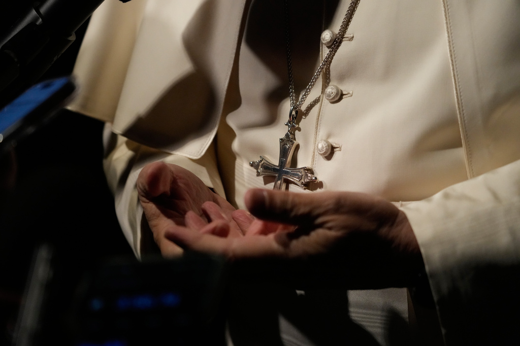 Pope Leo XIV talks to journalists as he leaves his residence in Castel Gandolfo, on the outskirts of Rome, to return to the Vatican, Tuesday, March 31, 2026. (AP Photo/Gregorio Borgia)