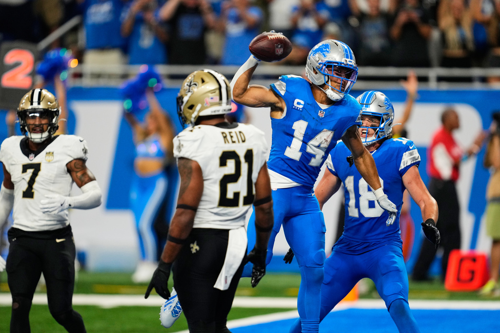 Detroit Lions wide receiver Amon-Ra St. Brown (14) celebrates his touchdown reception during overtime of an NFL football game against the New Orleans Saints, Sunday, Sept. 13, 2026, in Detroit. (AP Photo/Paul Sancya)