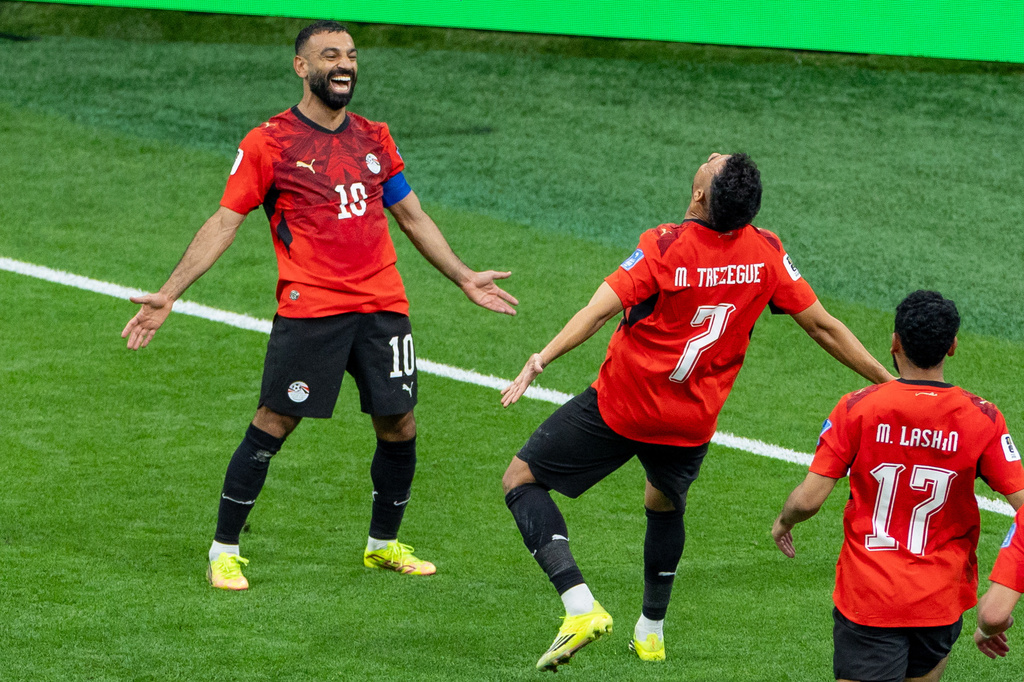 Egypt’s Trezeguet (7) celebrates his goal against New Zealand with teammate Mohamed Salah (10) during the World Cup Group G soccer match between New Zealand and Egypt in Vancouver, British Columbia, Sunday, June 21, 2026. (Timothy Matwey/The Canadian Press via AP)