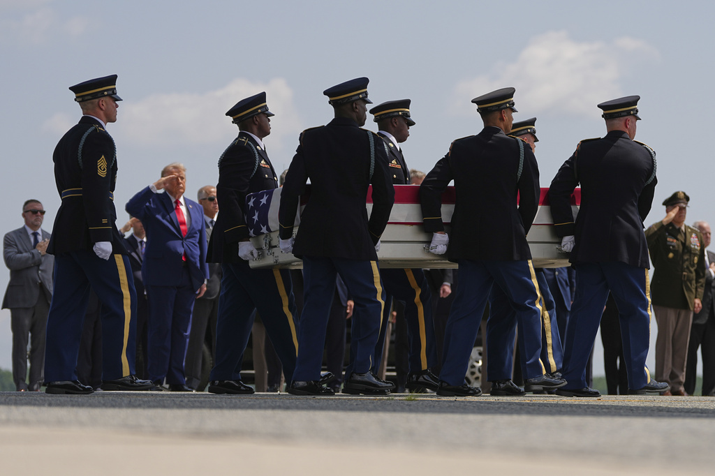 President Donald Trump salutes as a U.S. Army carry team moves a transfer case containing the remains of Pvt. Isabella Gonzales of Carrollton, Texas, Wednesday, July 22, 2026, at Dover Air Force Base, Del. (AP Photo/Matt Rourke)