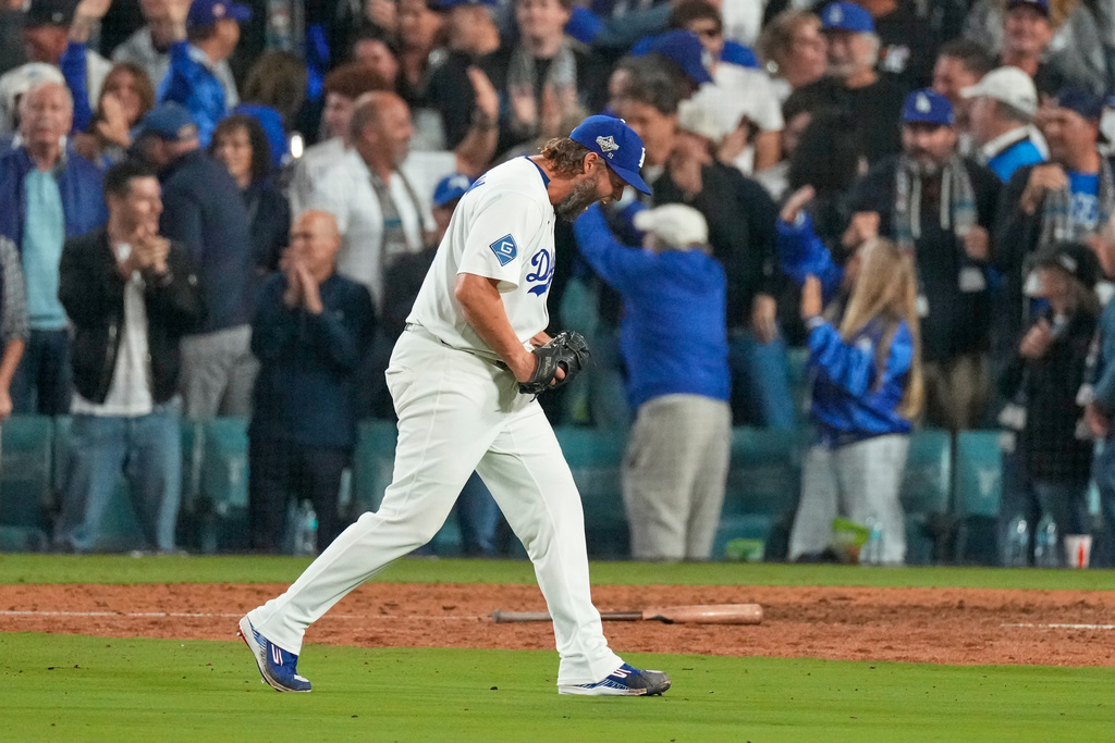 Los Angeles Dodgers pitcher Clayton Kershaw celebrates the end of the top of the 12th inning against the Toronto Blue Jays in Game 3 of baseball's World Series, Monday, Oct. 27, 2025, in Los Angeles. (AP Photo/Mark J. Terrill)