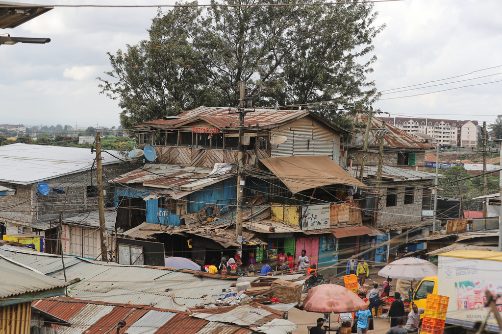 A view of electric wire poles and cables towering over the Kibera informal settlement in Nairobi, Kenya, Tuesday, March 31, 2026. (AP Photo/Henry Naminde)