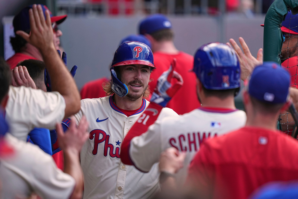 Philadelphia Phillies' Bryson Stott celebrates after hitting a home run off of Kansas City Royals pitcher John Schreiber during the eighth inning of a baseball game, Sunday, Sept. 14, 2025, in Philadelphia. (AP Photo/Matt Rourke)