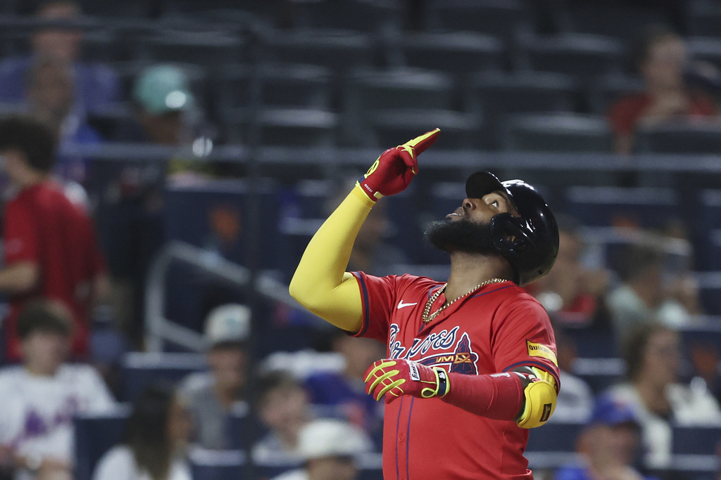 Atlanta Braves' Marcell Ozuna gestures after a home run during the sixth inning of a baseball game against the New York Mets, Wednesday, Aug. 13, 2025, in New York. (AP Photo/Heather Khalifa)